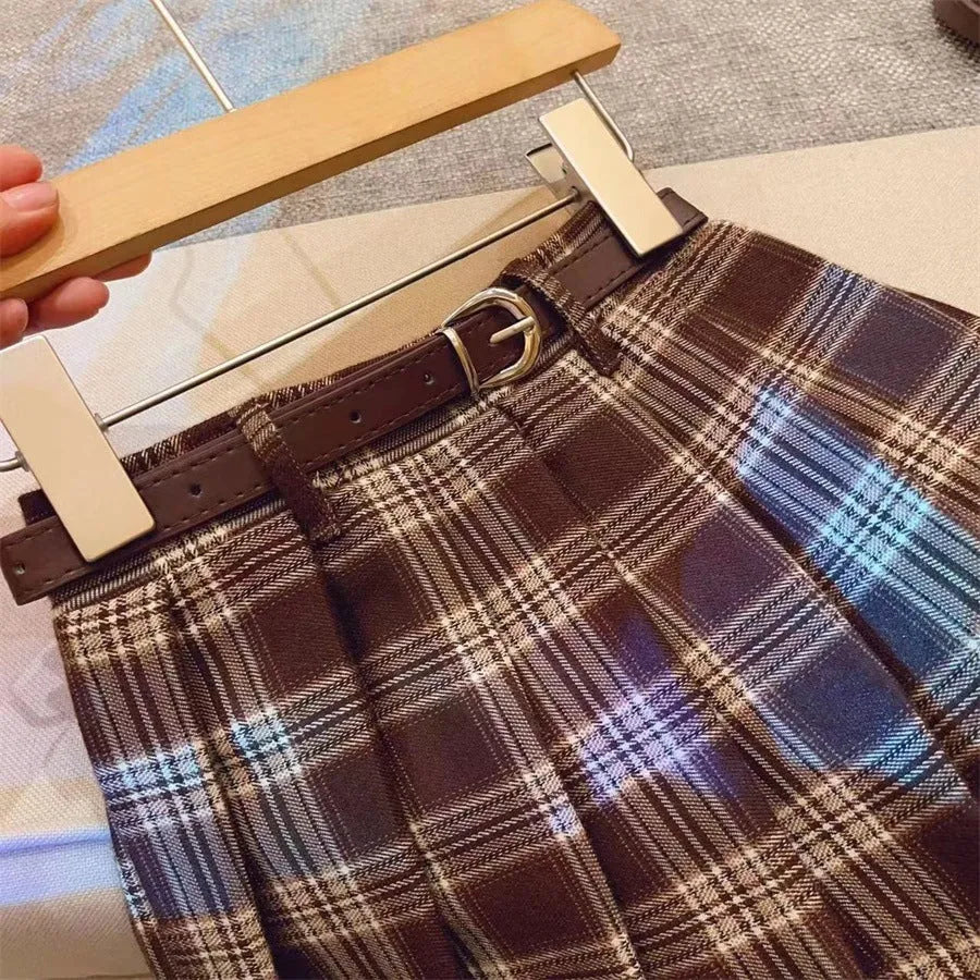 Girls plaid pleated A-line skirt in cotton blend fabric shown in casual setting