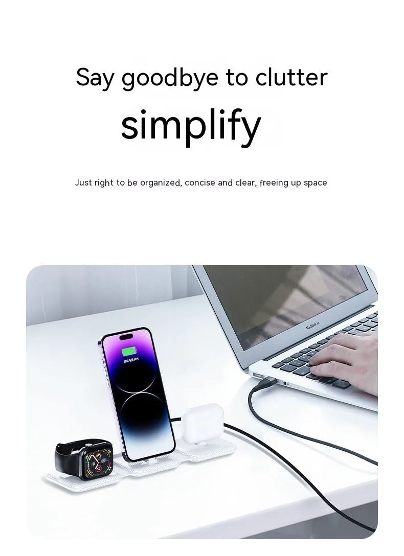 A75 Three-in-one Wireless Charger in white, charging a smartphone, earbuds, and smartwatch on a desk