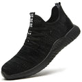 Black steel toe cap safety shoes with anti-static properties and EVA construction on a work floor.