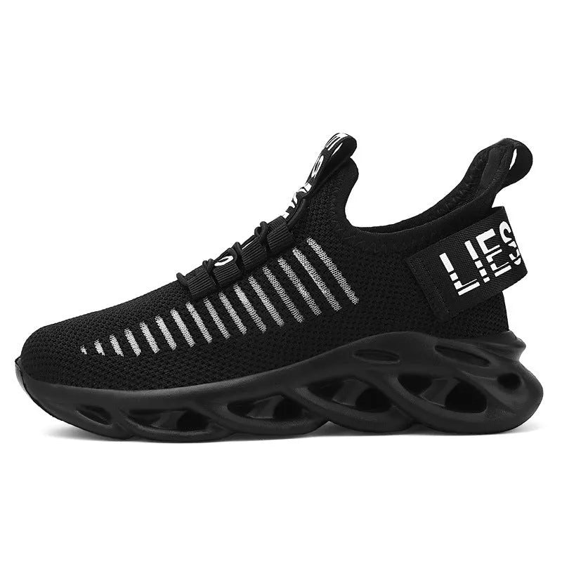 Child wearing trendy black coconut sneakers with Velcro strap and fabric upper.