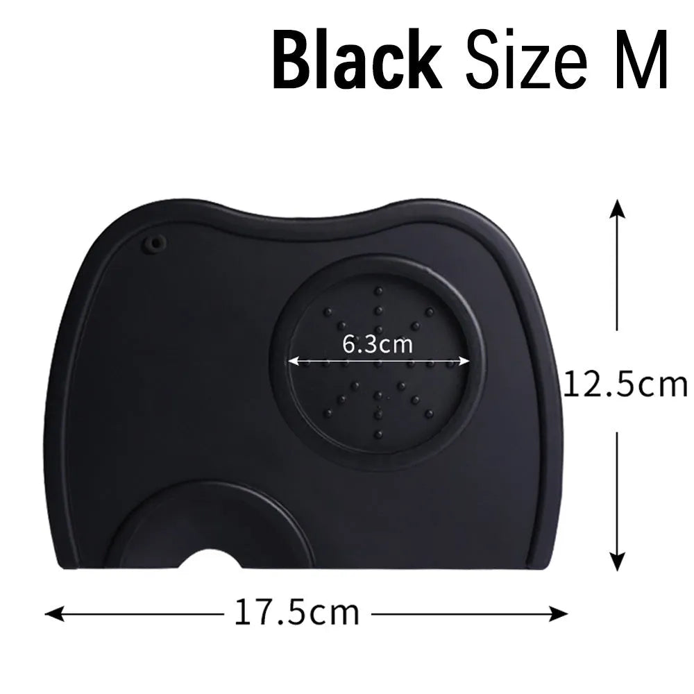 Black silicone coffee tamper pad with stainless steel base for non-slip espresso preparation