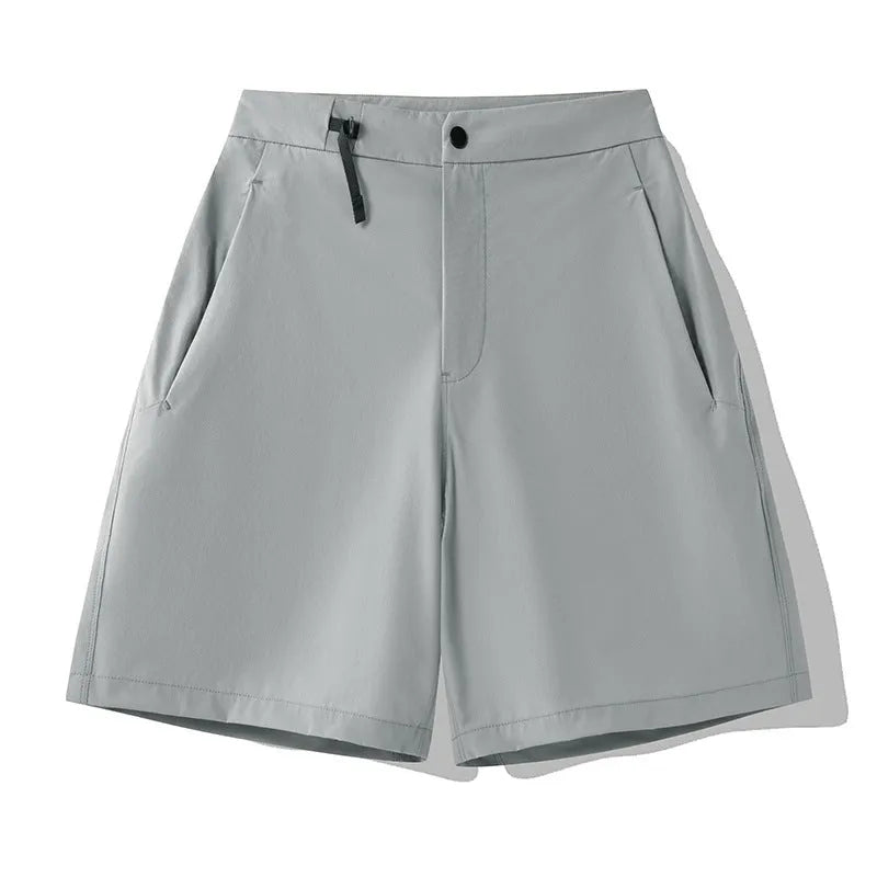 Men's solid colour quick-drying sports shorts with elastic construction, shown in khaki colour
