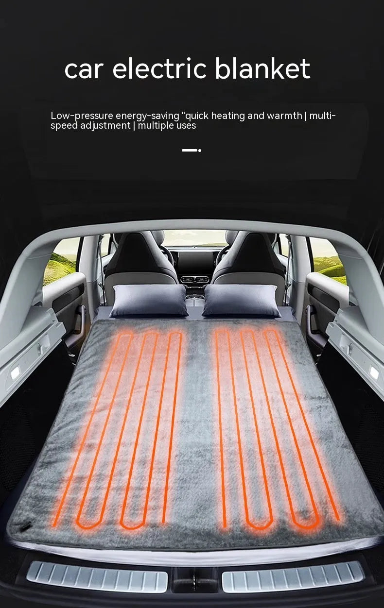 Grey 12V car electric blanket plugged into a vehicle cigarette lighter socket.