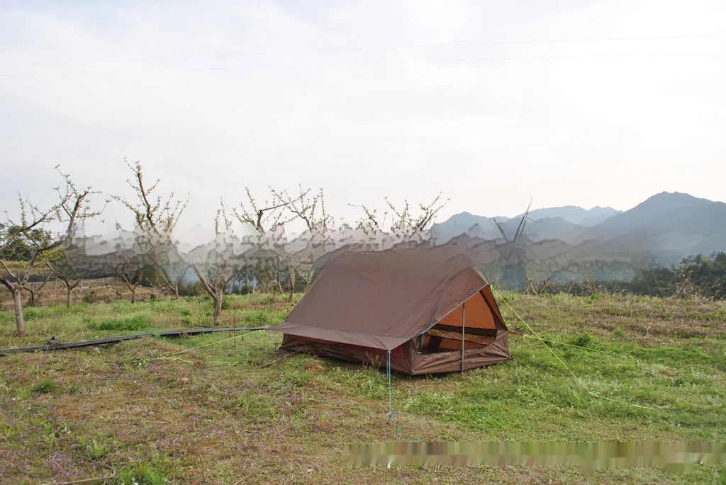 Brown or white A-line hiking tent pitched using hiking canes, showing spacious interior for 2-3 people.