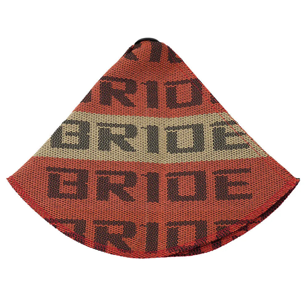 Canvas dust cover draped over a racing bucket seat in a vehicle interior.