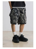 Straight-leg denim shorts in black and army green colours showing loose casual fit and mid waist design