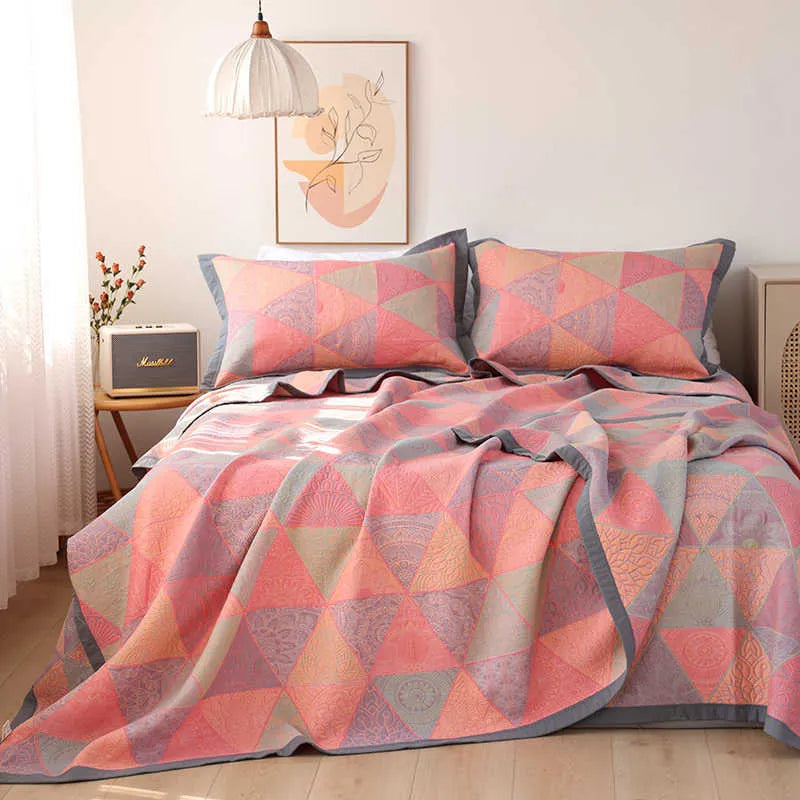 Cotton gauze bed blanket set with floral patterns showing blanket and two pillowcases