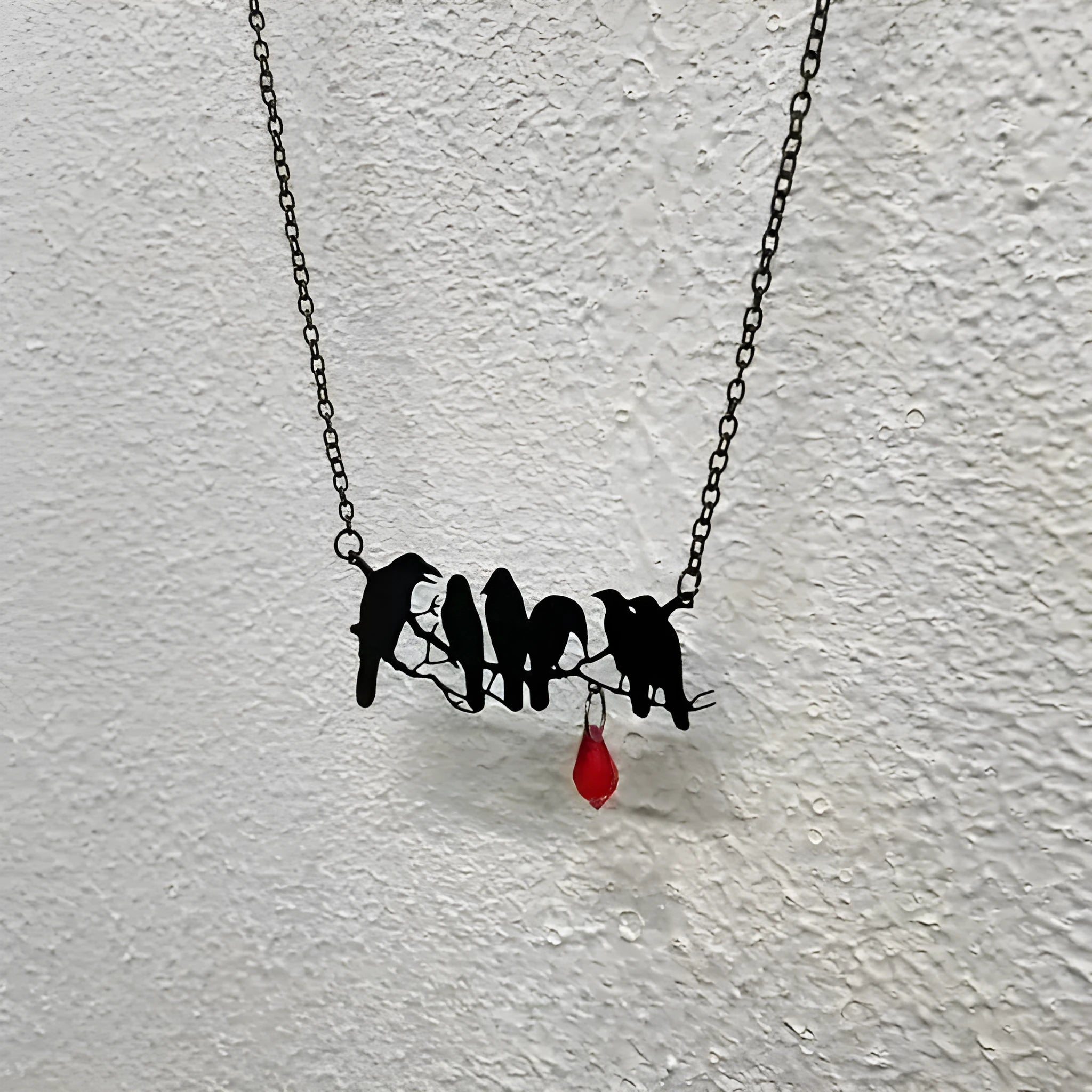 Black gothic crow necklace with detailed bird pendant on cross chain for women