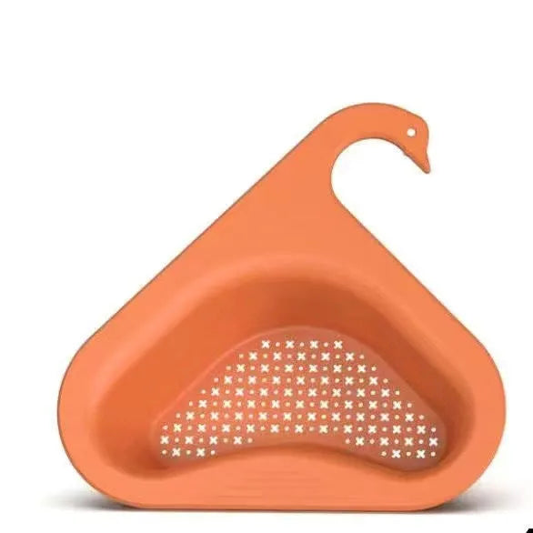 Yellow hanging swan drain basket made of plastic, fitted on a kitchen sink edge with space for vegetables and utensils