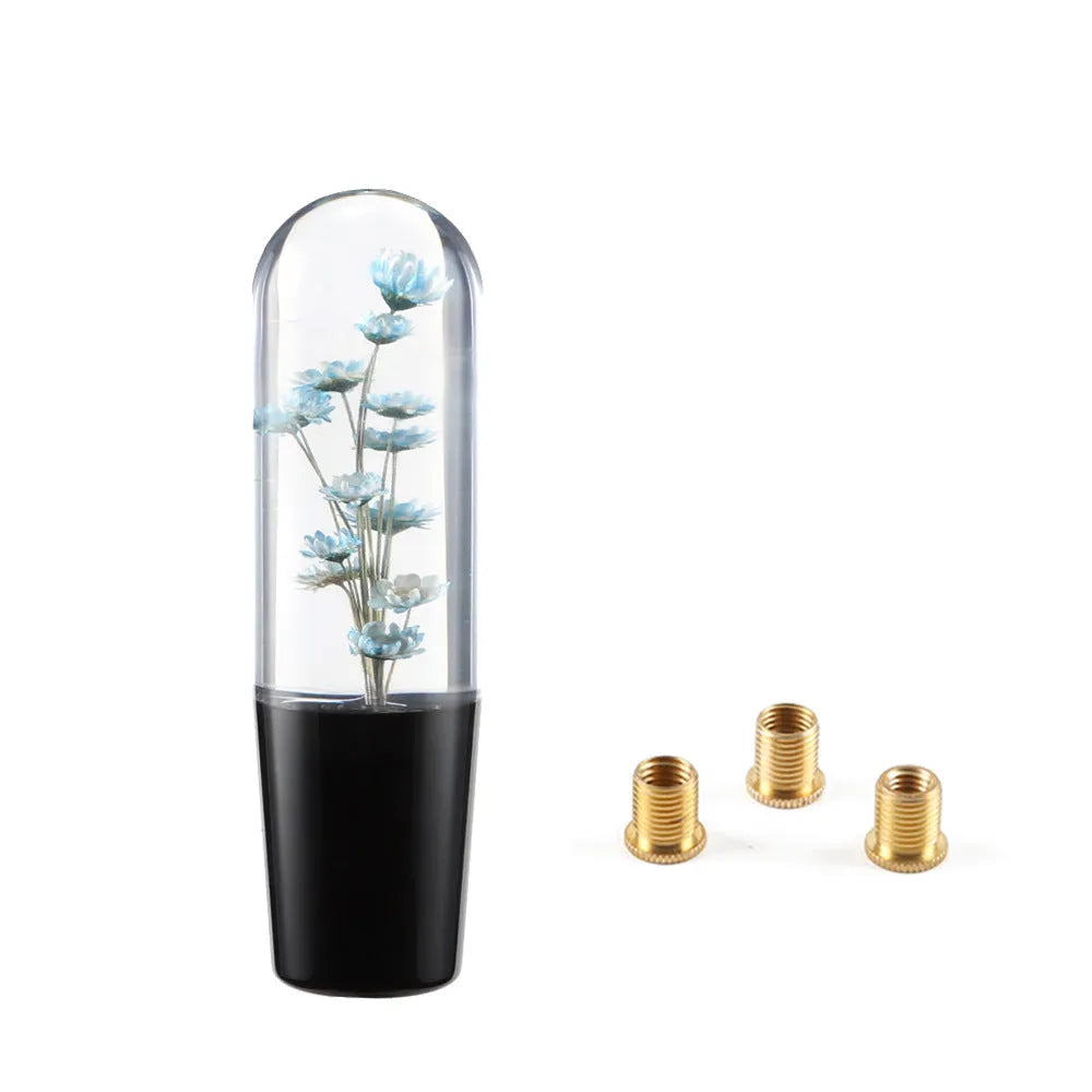 Transparent crystal car gear shift knob in assorted colours with three metal adapters.