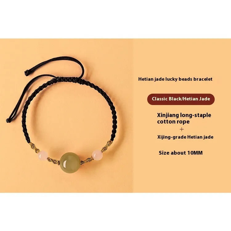 Hand-woven red rope bracelet with Hetian jade lucky beads and Chinese motif carvings