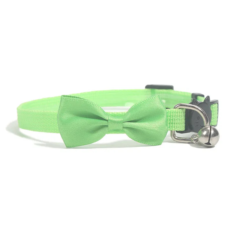 Adjustable striped nylon cat collar with a small bell, shown in multiple colour options on a white background.
