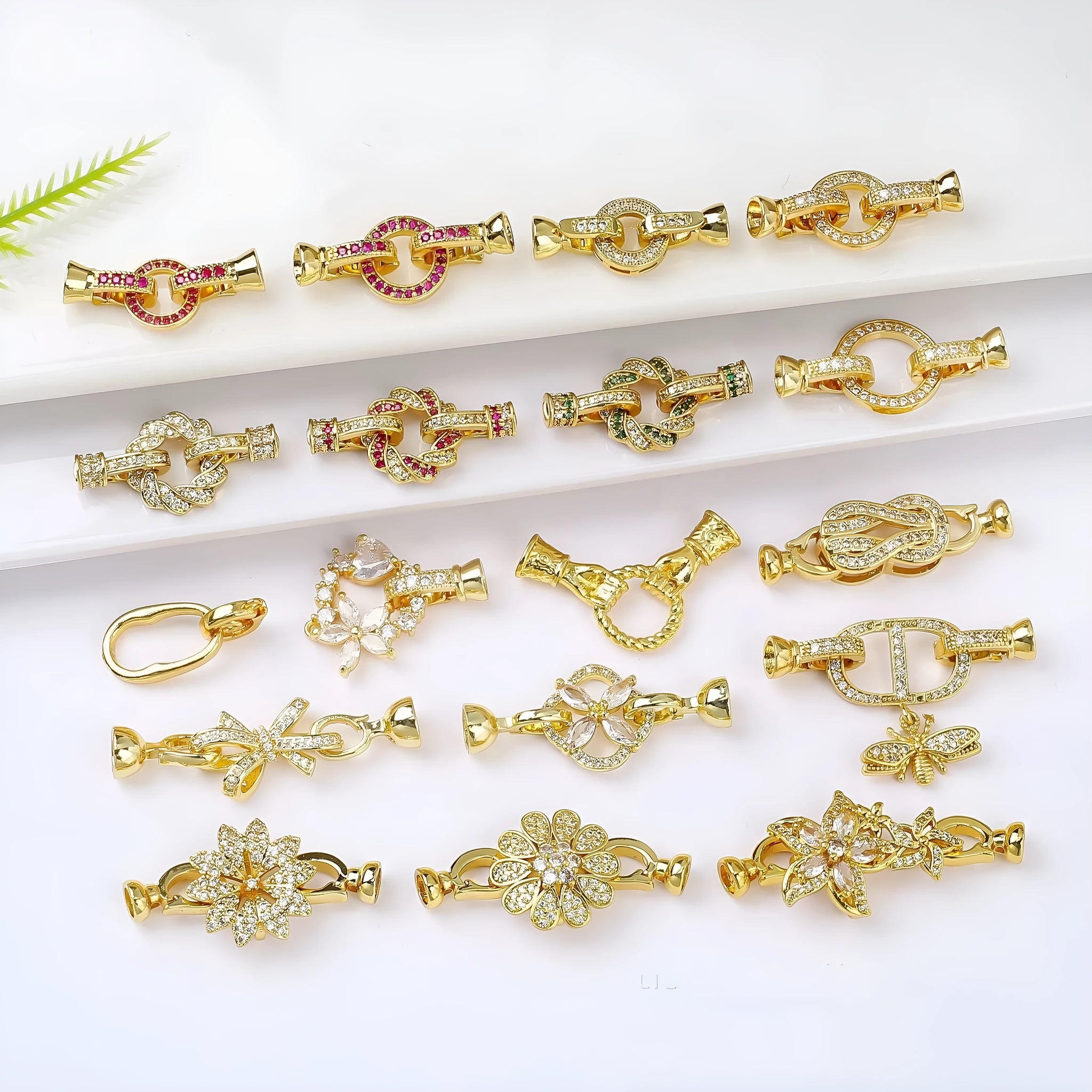Small gold plated buckle clasp for DIY jewellery making on a white background.