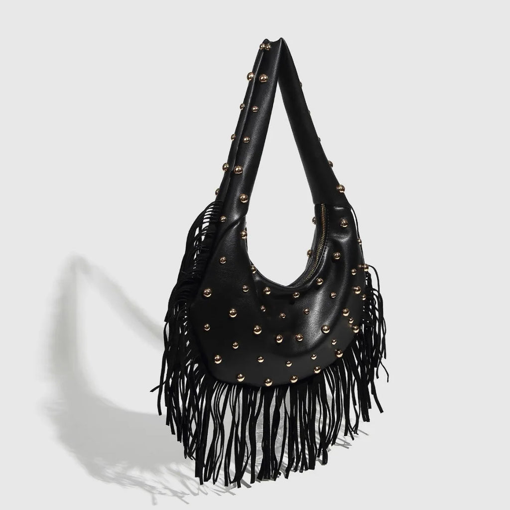 Retro black shoulder handbag with a tassel detail and an internal mobile phone pocket.