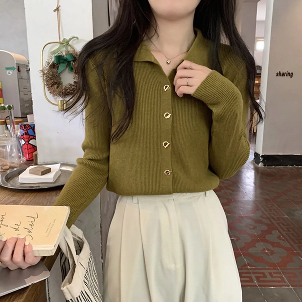 Women's beige loose-fit long-sleeved viscose knitted cardigan shown open as a layering piece.