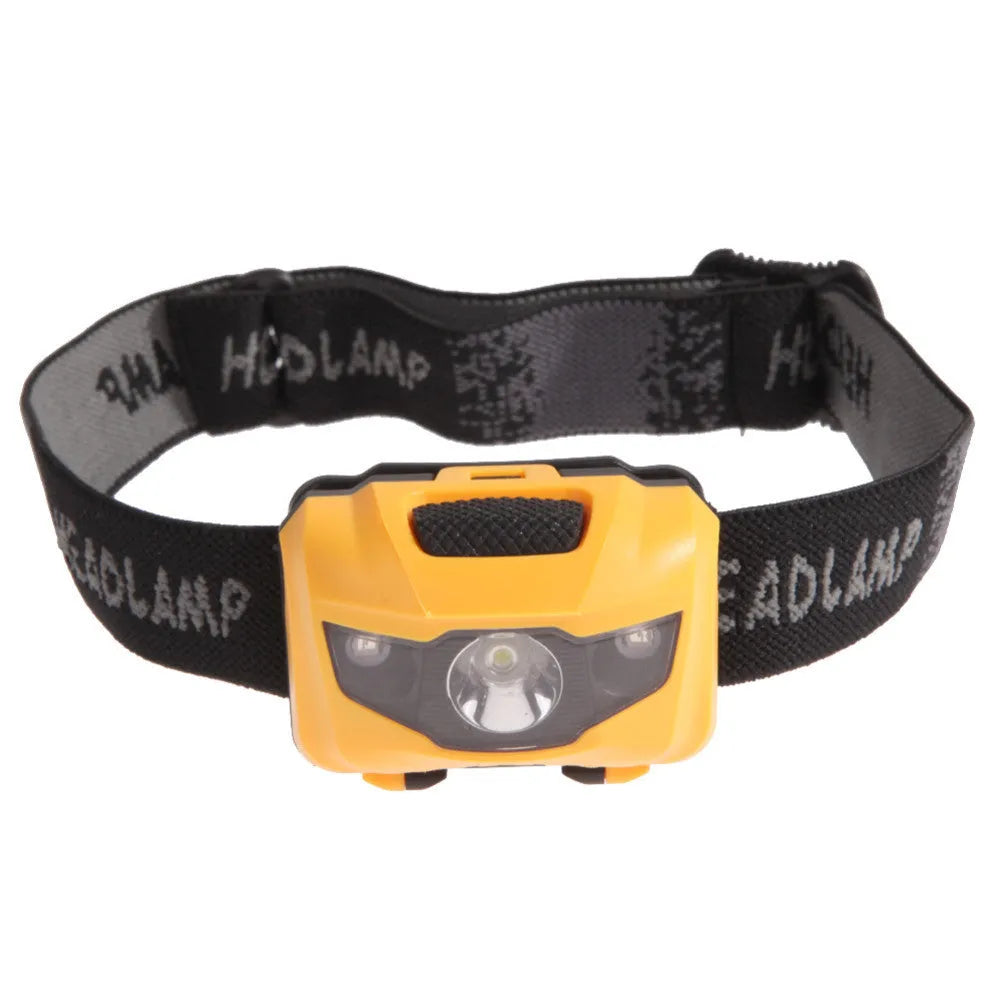 Black head torch with white and red LEDs mounted on an adjustable head strap for outdoor use.