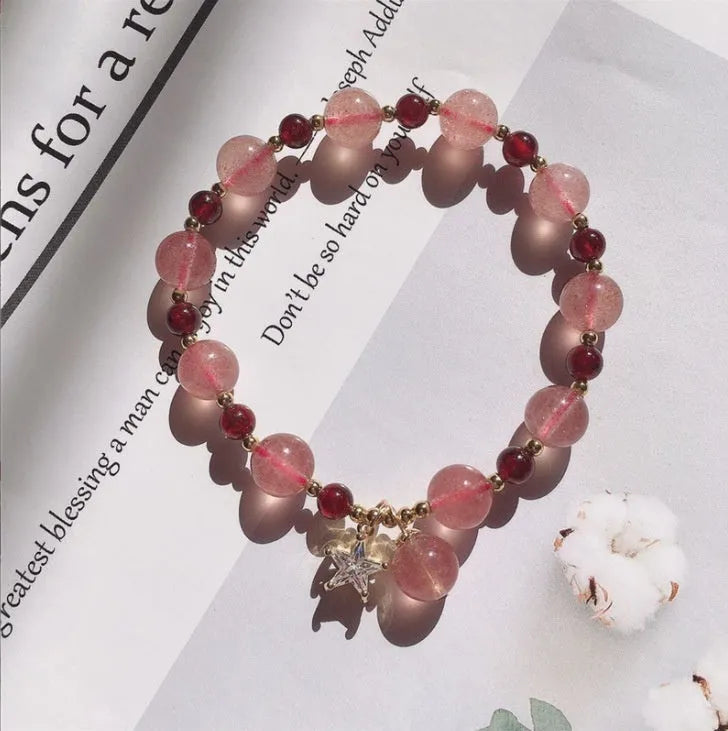 Handcrafted strawberry quartz crystal bracelet with Hetian jade peach blossom charms for women