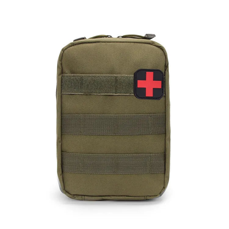 Army green nylon tactical medical accessory pouch with hook-and-loop fastening, shown next to a tape measure.