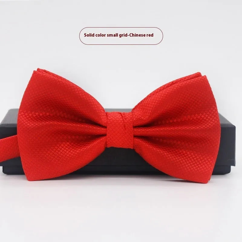 Solid colour polyester bow tie with flat head design measuring 12cm by 6cm