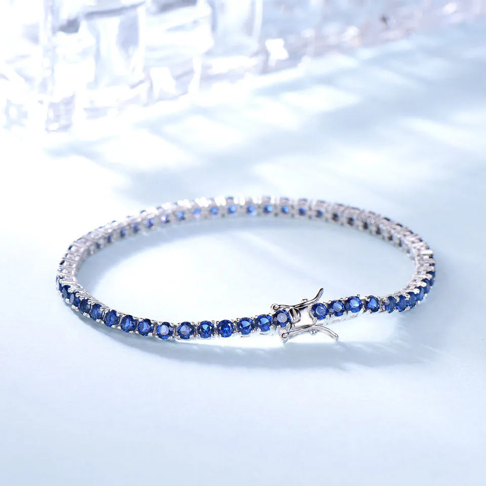925 sterling silver nano sapphire tennis chain bracelet with drop shape stones on white background