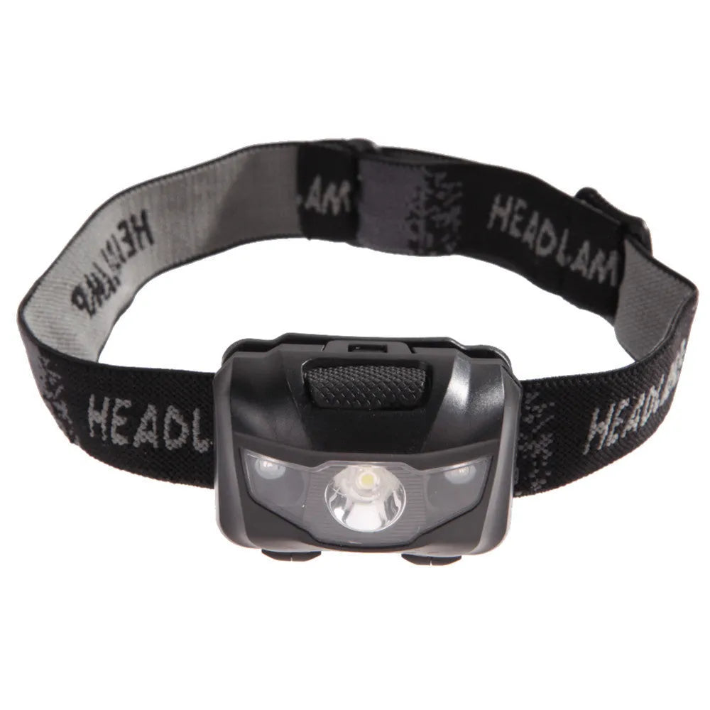 Black head torch with white and red LEDs mounted on an adjustable head strap for outdoor use.