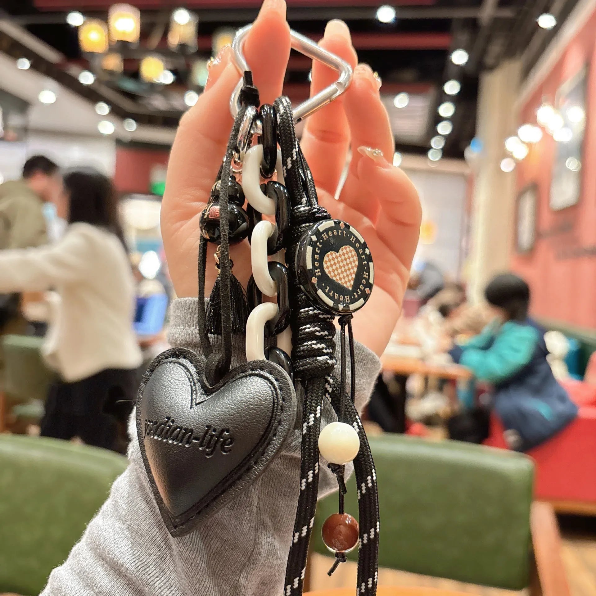 Leather heart-shaped and small gourd pendant keychain with woven rope loop, available in brown, black, pink, red