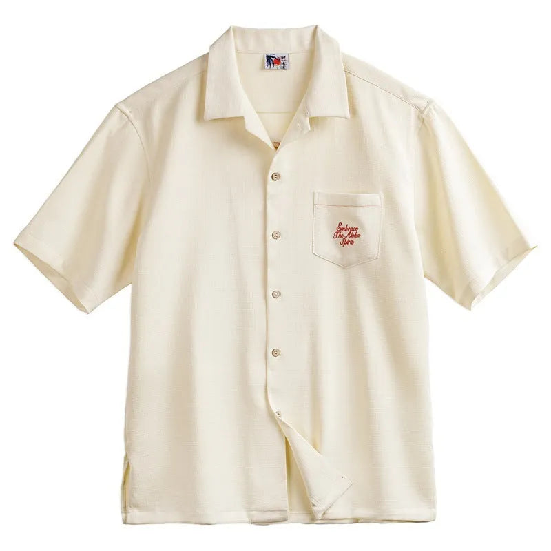 Light apricot men's short sleeve shirt with a bamboo floral pattern and a Cuban collar.
