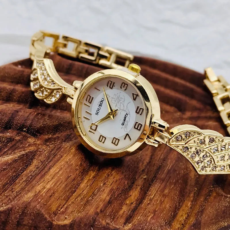 Stainless steel women's watch with round dial on a wrist, showing the Vachette clasp buckle.