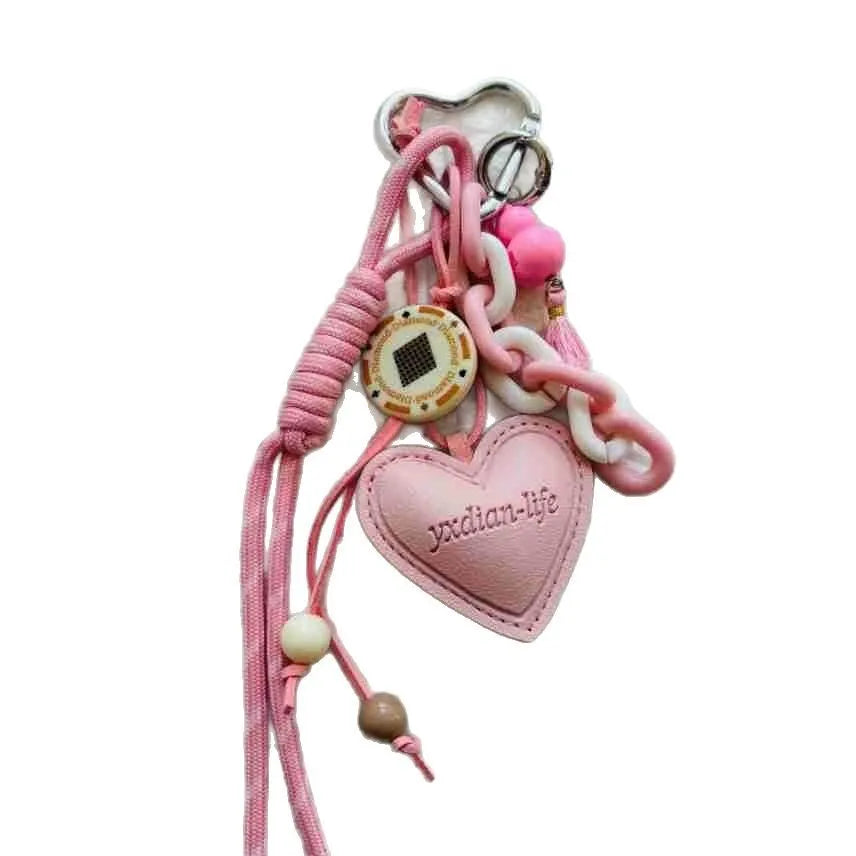 Leather heart-shaped and small gourd pendant keychain with woven rope loop, available in brown, black, pink, red