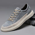 Men's grey casual leather skate shoes with round toe, low top design and rubber soles