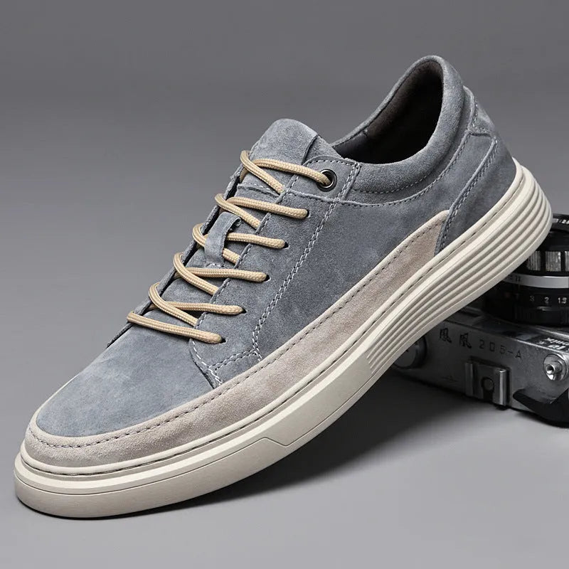 Men's grey casual leather skate shoes with round toe, low top design and rubber soles