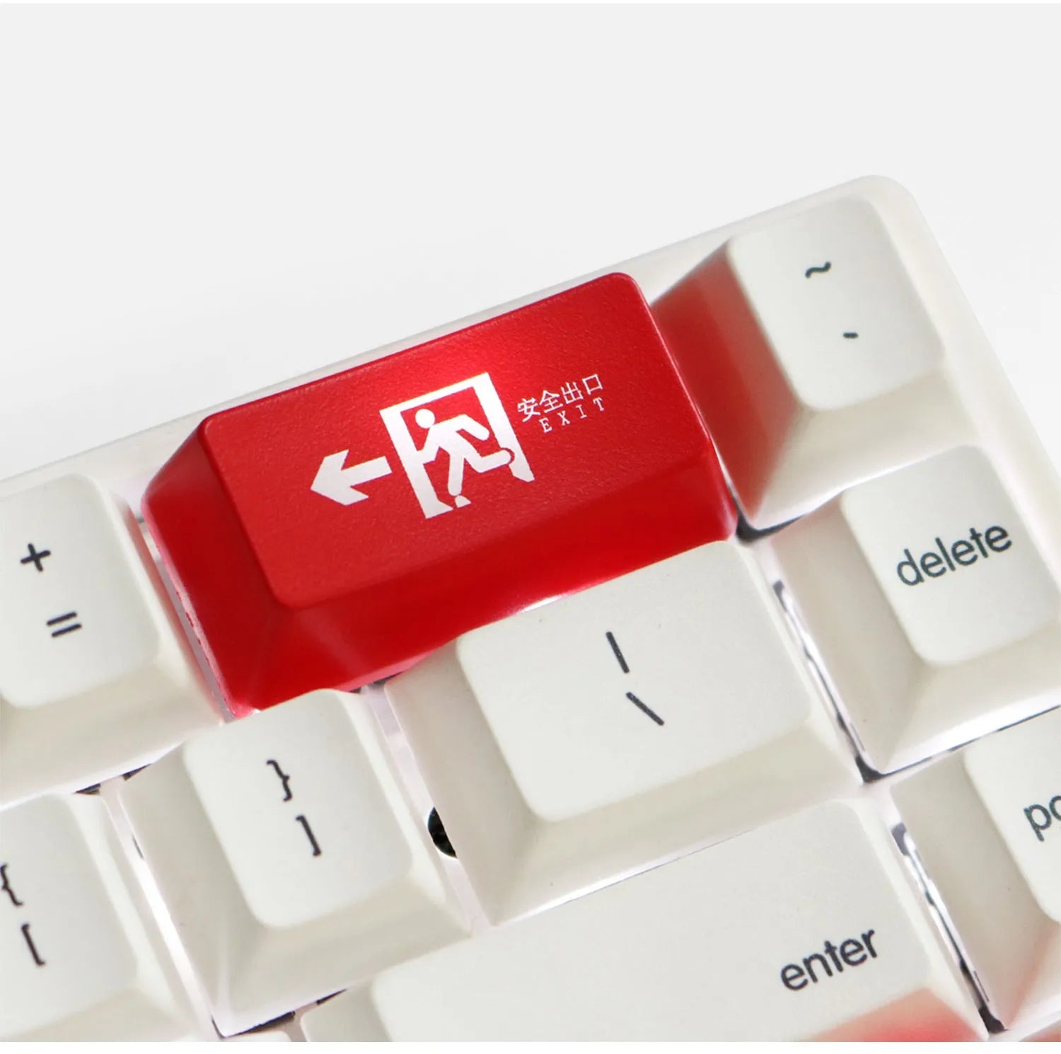 Red Safety Evacuation Exit icon key cap for a mechanical keyboard backspace key.