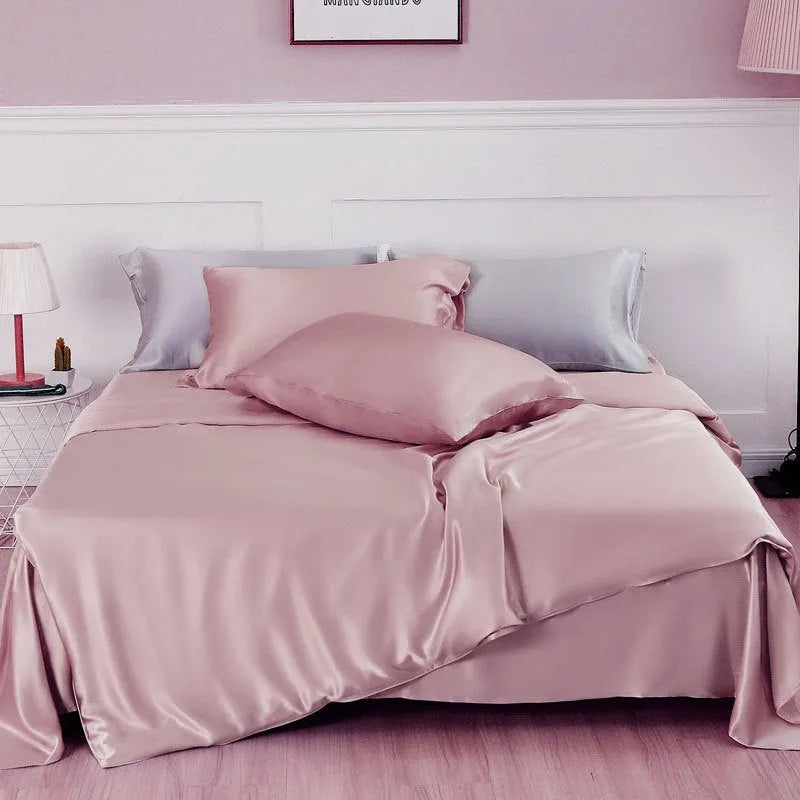 Reversible solid colour silk duvet cover shown in lotus pink, double-sided design.