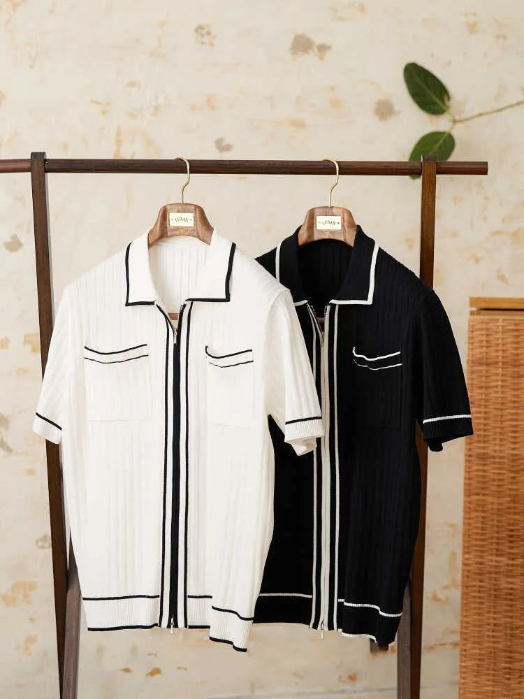 Slim-fit man's knitted polo shirt with a lapel collar and short sleeves in a black viscose blend fabric.