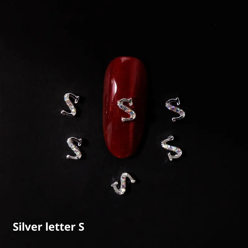 Gold alloy letter A nail ornament charm with crystal detail on a square chain base