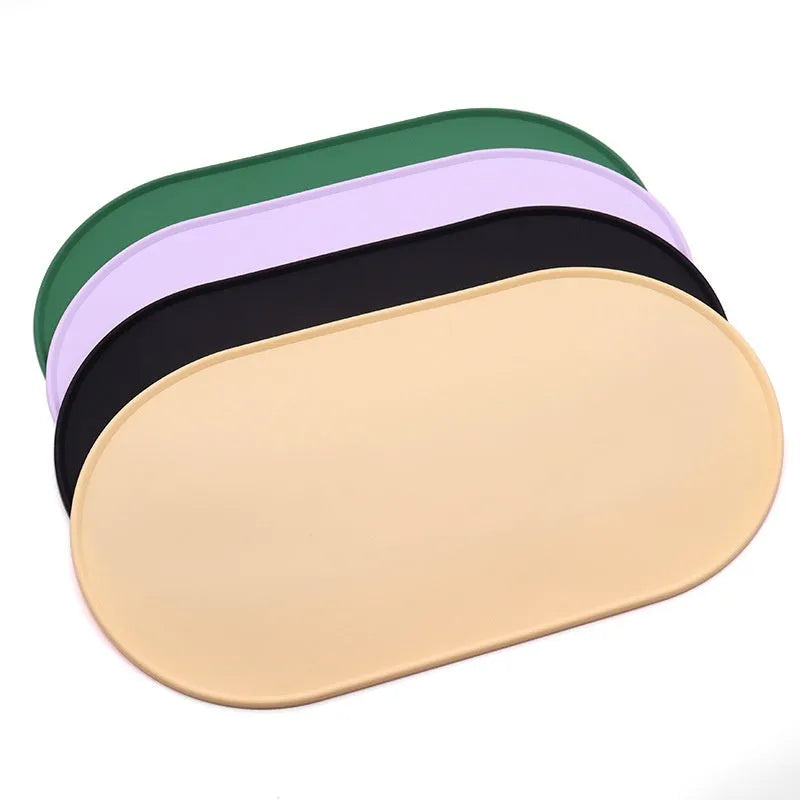 Green silicone waterproof cat feeding placemat with non-slip backing under a food bowl