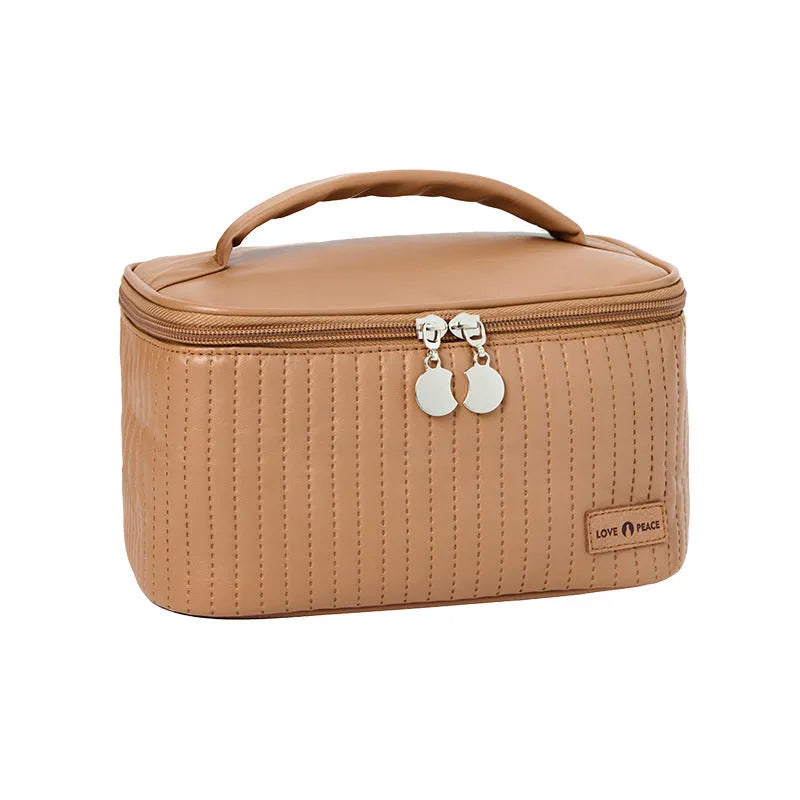Open-top round cake-shaped makeup bag in a solid PU leather colour from the pink, coffee, beige, blue, green, purple range.
