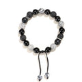 Black agate map stone volcanic rock bracelet in diamond shape, New Chinese style, on wrist.