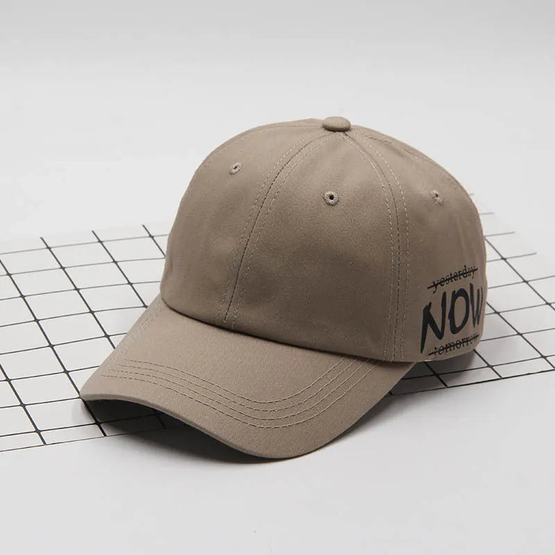 Cotton baseball cap with letter embroidery, curved brim, dome top, adjustable size, in green colour.