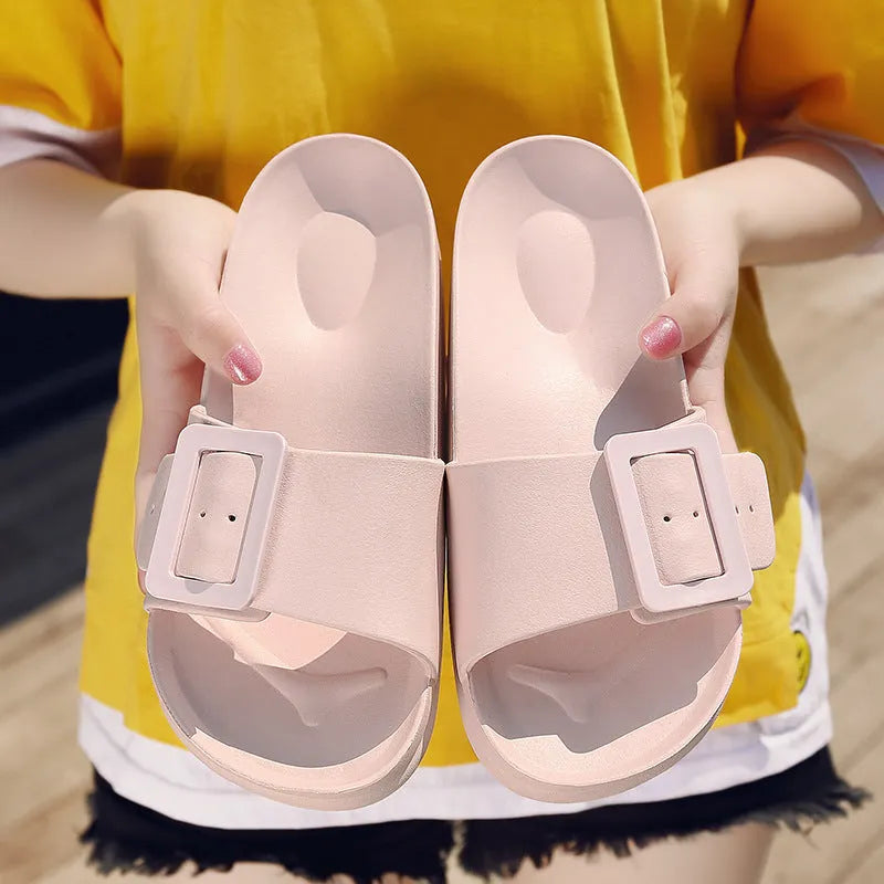 Women's grey blue buckle fastening flip-flop sandals with a soft EVA sole on a white background.