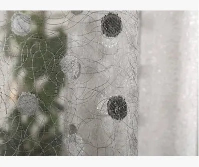 Single blackout curtain panel showing hook heading style with blackout lining visible at edge