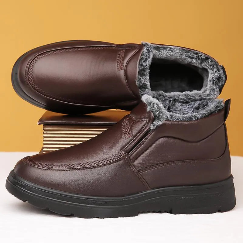 Men's black winter slip-on shoes with fleece lining and rubber sole on grey background