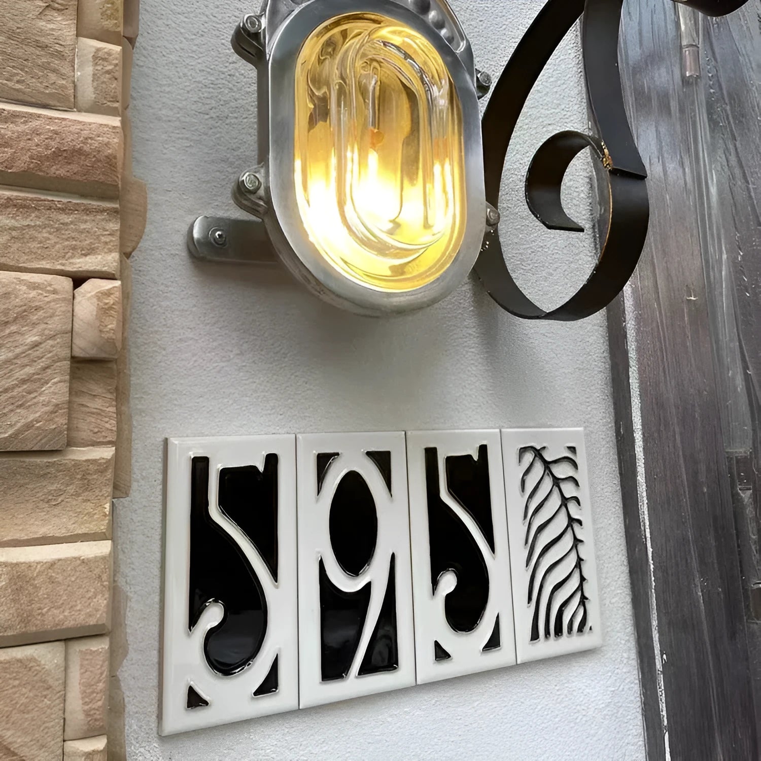 Handmade retro enamel ceramic doorplate showing a number on a glossy surface