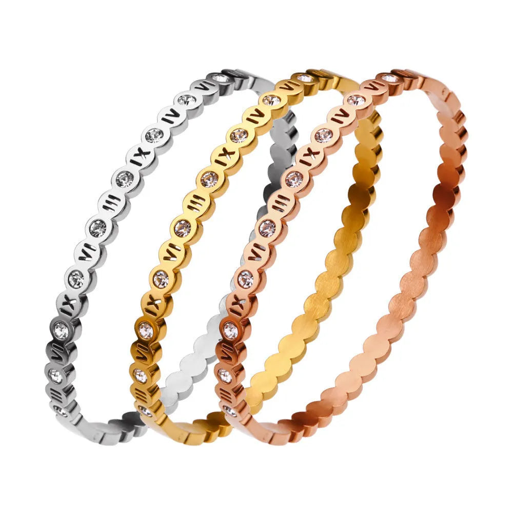 Titanium steel bracelet with number design in gold, rose gold, and steel colour options.