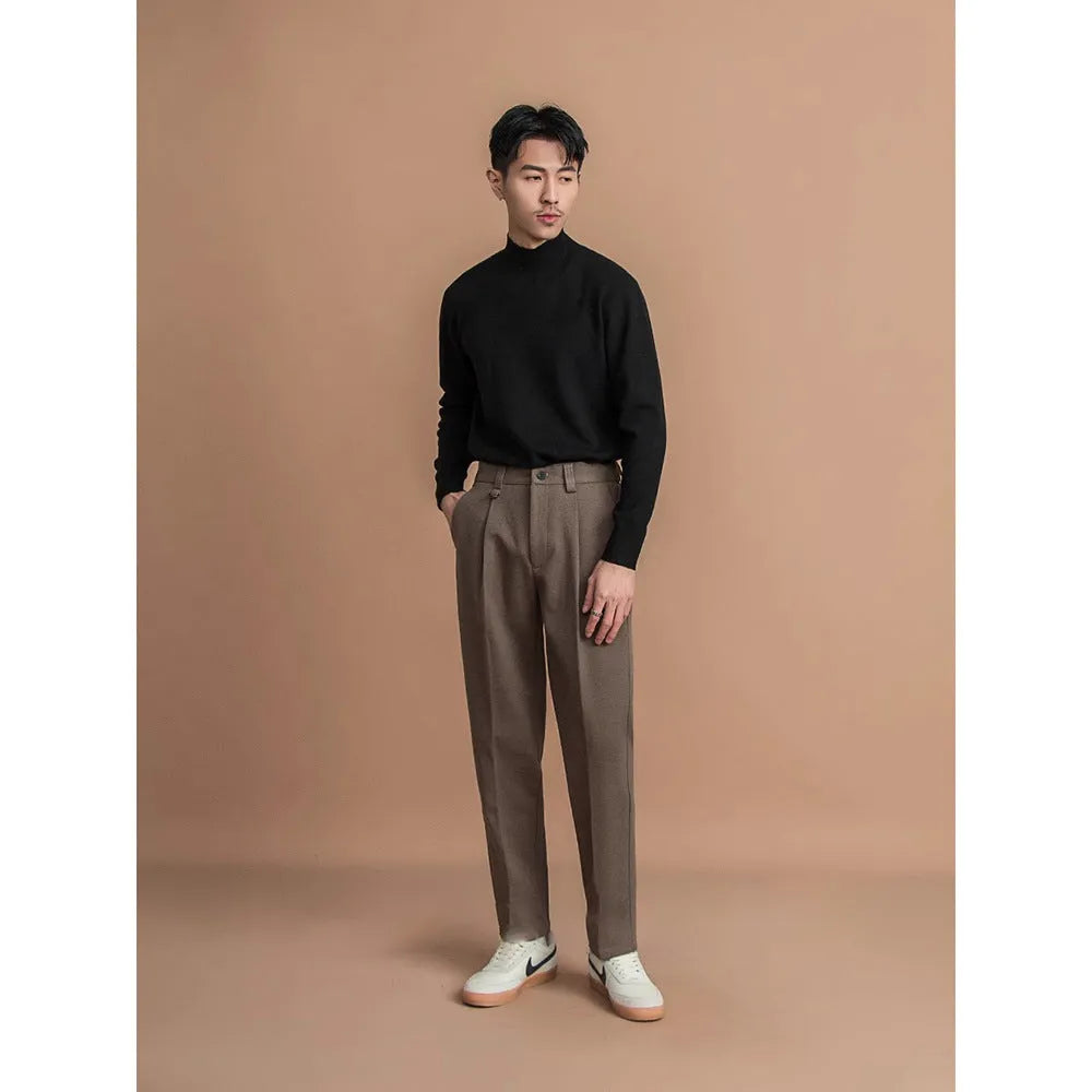 Men's straight-leg casual suit trousers in black, shown with a draped fit.