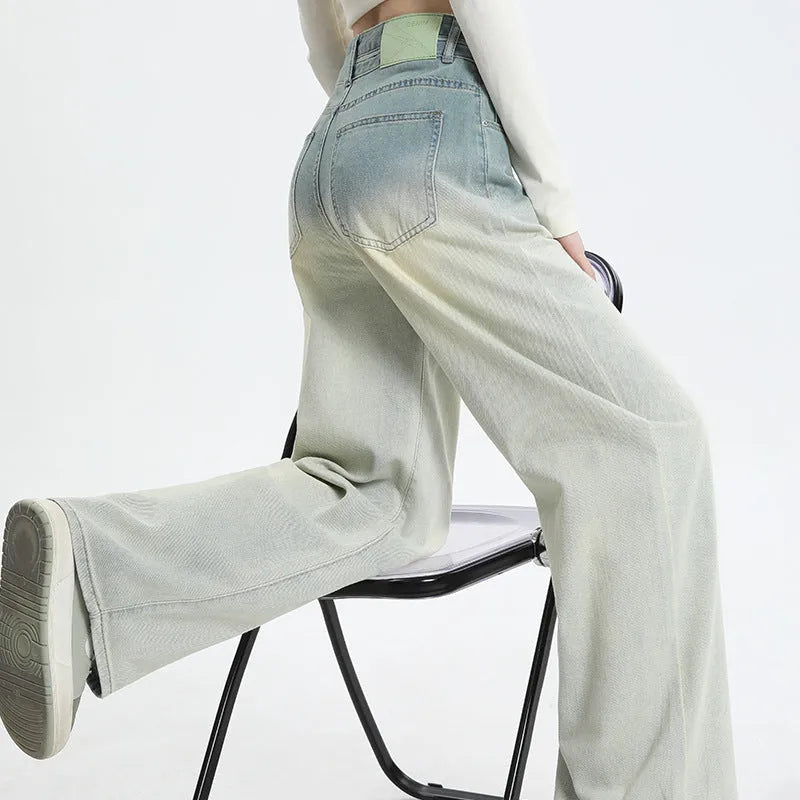 Women's gradient blue straight-leg denim trousers with wide leg silhouette on hanger