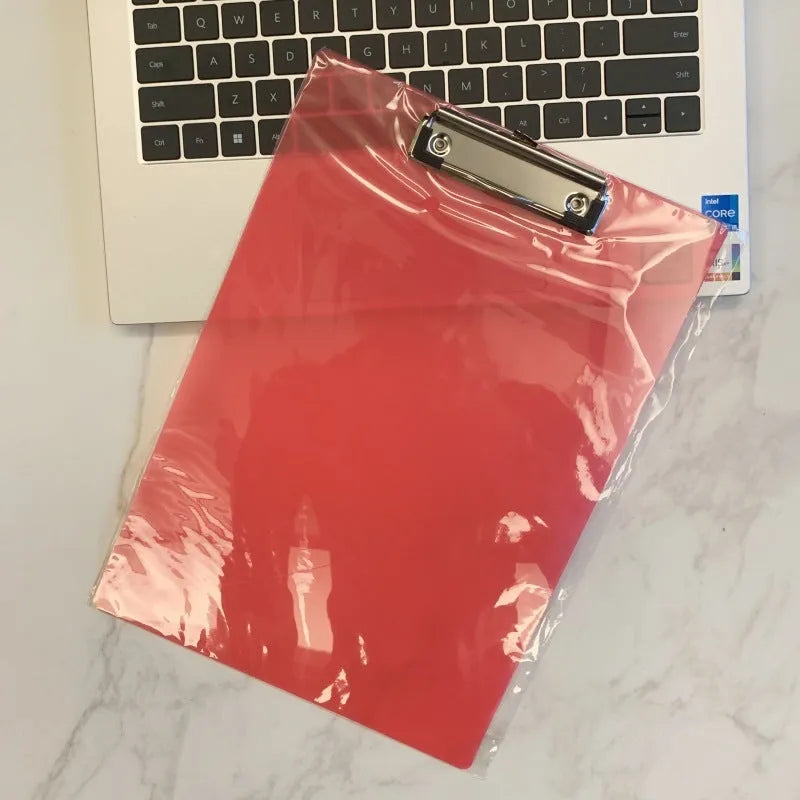 Transparent A4 clipboard with metal clip holding white paper, available in blue, green, red, and white.