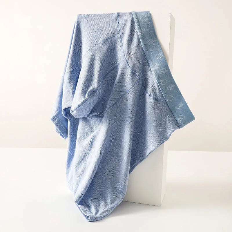 Men's lengthened modal ice silk boxer shorts with hip lifting in blue, front view