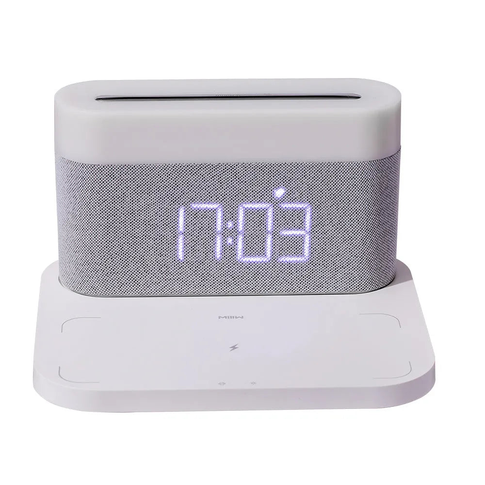 Modern black and white wireless charging desk clock with integrated night light and table lamp.