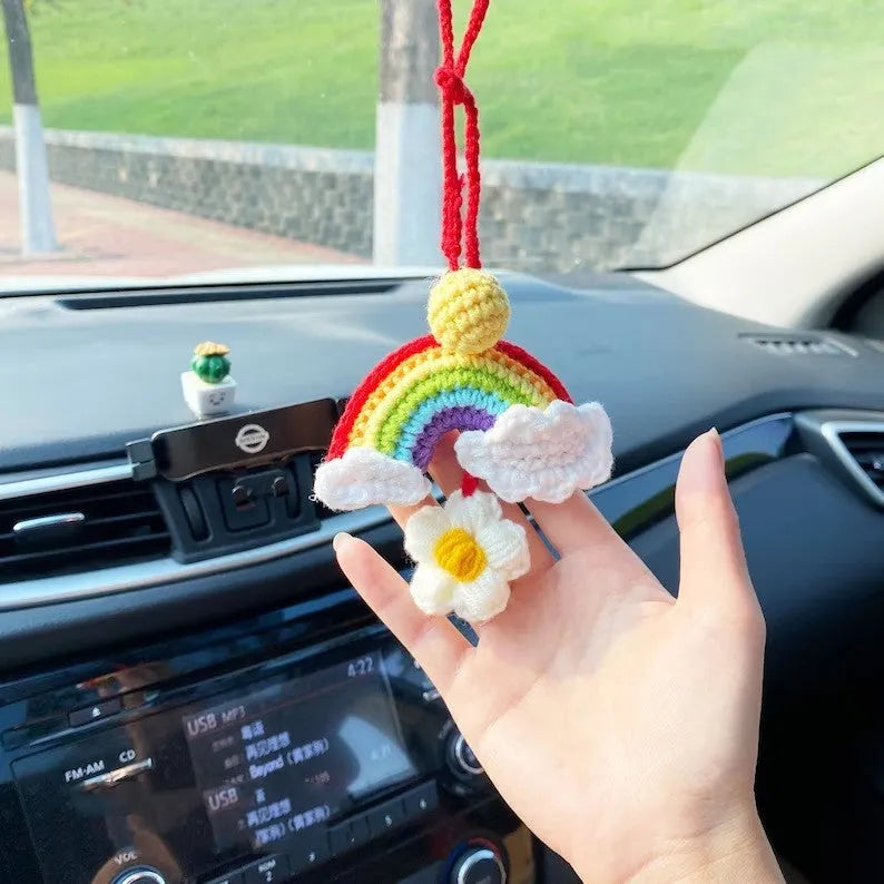 Handmade crocheted rainbow flower car pendant in wool with colourful avocado, pink, and red patterns